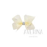 LYNDI パフ Mサイズ〈リボンカバーヘアスライド〉オーガンジーアイボリー｜キラキラリボンがポイントのふんわりヘアボウ